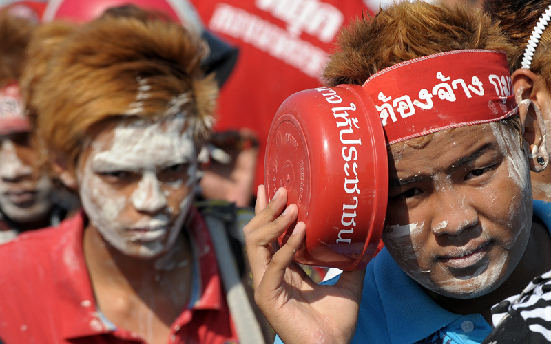 Anti-government 'Red Shirt' protesters celebrate the Songkran festival marking the Thai new year, at Democracy monument, the site of fierce street battles between protesters and the army at the week-end, in Bangkok on April 13. The Thai authorities will allow "Red Shirt" protesters to keep up their rallies in Bangkok for months if they do not use violence, Deputy Prime Minister Suthep Thaugsuban said. (AFP)