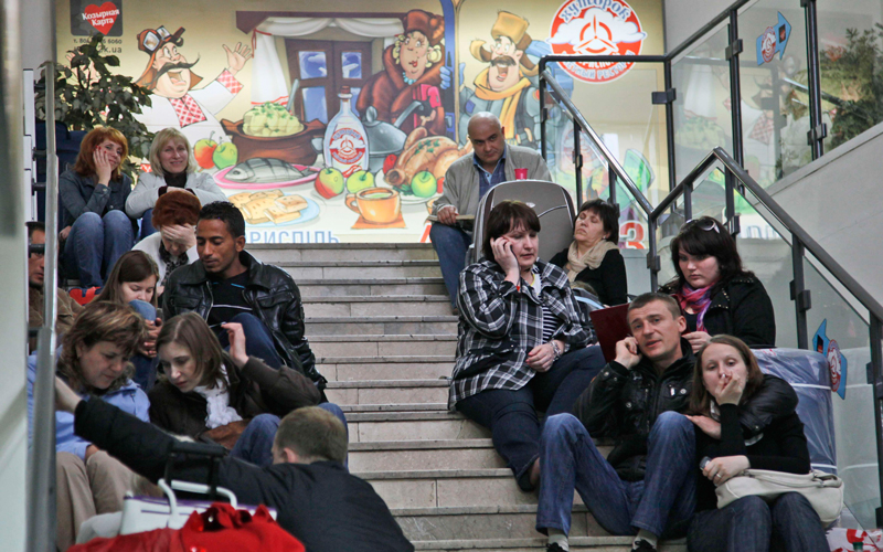 Passengers wait their flights at Borispol airport, near Kiev, as hundreds of commercial flights across northern and eastern Europe are canceled because of a drifting plume of volcanic ash originating from a volcanic eruption in Iceland, on April 17. The Icelandic volcano that erupted Wednesday has sent an enormous cloud of microscopic ash particles across northern Europe, grounding aircraft across the continent. (AP)