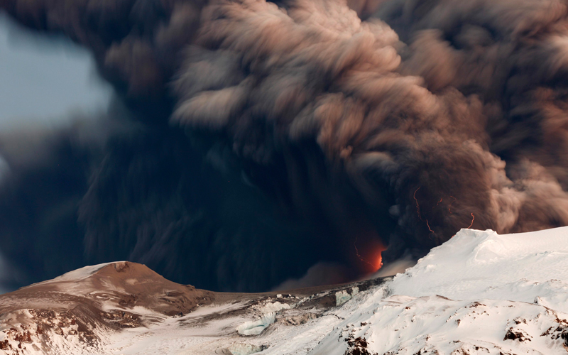 Smoke and lava are seen as a volcano erupts in Eyjafjallajokul on April 17. An Icelandic volcano that is spewing ash into the air and wreaking havoc on flights across Europe appeared to be easing up on Saturday but could continue to erupt for days or even months to come, officials said. (Reuters)