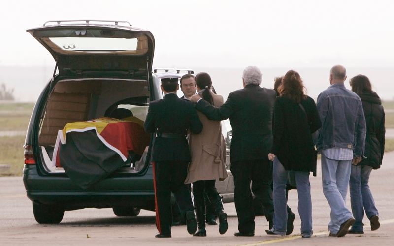 Family members of one of the Spanish soldiers who died in Haiti in a helicopter crash on Friday, walk towards the hearse as their remains were repatriated to a military base in Rota, southern Spain on April 19. Four Spanish soldiers were killed when their helicopter crashed into a mountain in earthquake-stricken Haiti on Friday, UN and local officials said. (Reuters)