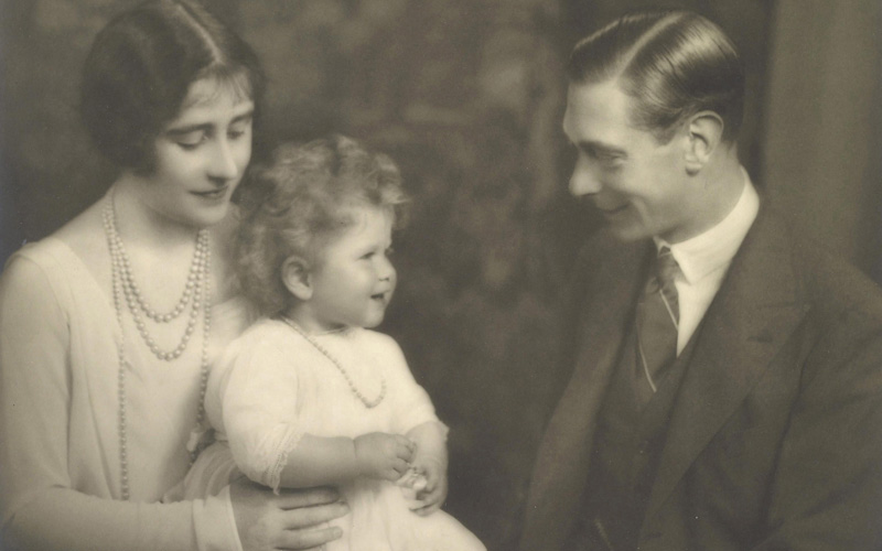 This June 30, 1927 photo provided Wednesday, April 21, 2010 by the Royal Collection shows the Duke and Duchess of York with their daughter, then-Princess Elizabeth, who later became Britain's Queen Elizabeth II.  The Royal Collection released photos of the future Queen's first portrait sessions on Wednesday to mark her 84th birthday. (AP)