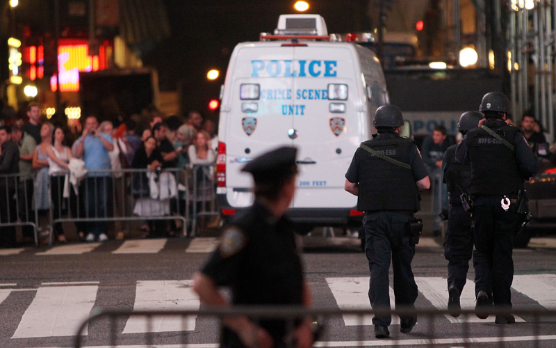 Police keep watch in Times Square after an incident involving a suspicious vehicle caused authorities to shut down parts of Times Square May 1, 2010 in New York City. Both vehicular and pedestrian traffic has been diverted from the area, reportedly causing the cancelation of at least one Broadway show in the area. (GETTY IMAGES)