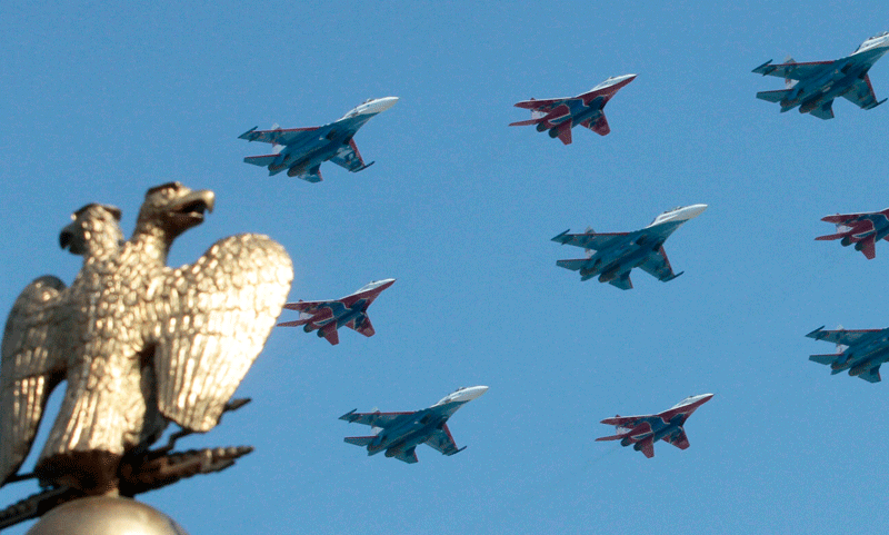 A group of Russian fighters fly in formation over the two-headed eagle during a military parade in Red Square in Moscow on May 9, 2010. Nato troops will march across Red Square on Sunday as Russia marks the 65th anniversary of victory over Nazi Germany, a gesture of friendship to the West which has won praise from President Barack Obama but enraged Communists. (Reuters)