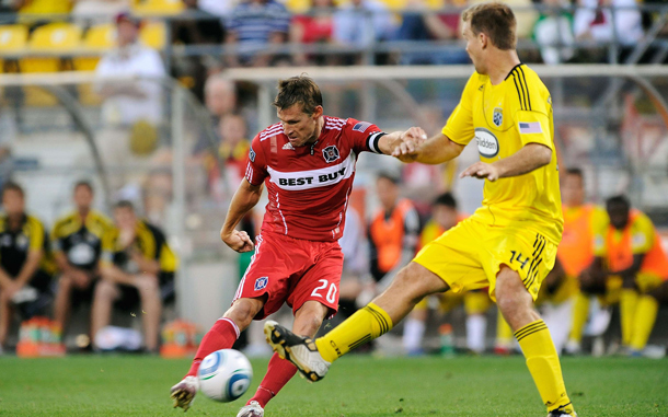 Brian McBride #20 of the Chicago Fire kicks the ball past Chad Marshall #14 of the Columbus Crew at Crew Stadium in Columbus, Ohio. (AFP)