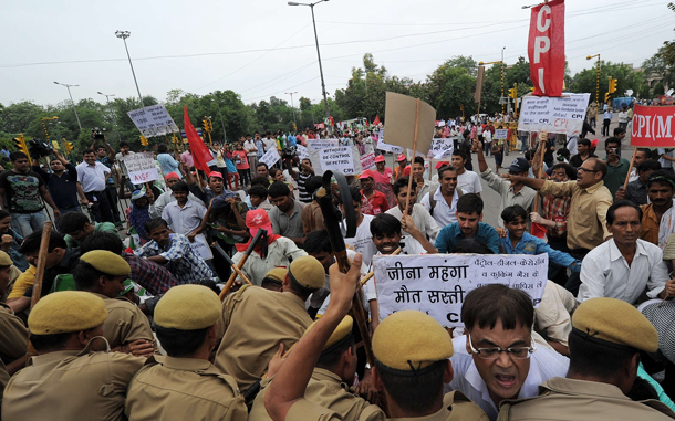 Indian activists of Communist Party of India (Marxist) (CPI-M) scuffle with city police during a nationwide strike in protest of fuel price hikes in New Delhi. Police came out in force in cities across India for an opposition-led national strike over fuel price rises that disrupted flights and train services, and closed schools and businesses. The strike was called by the main opposition Bharatiya Janata Party (BJP) and leftist parties in a concerted show of strength against the Congress-led government's reform programme. (AFP)