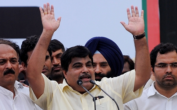 India's opposition Bharatiya Janata Party (BJP) National President Nitin Gadkari (C), standing with other party members, addresses a demonstration at Chandni Chowk in New Delhi. An opposition-led strike over fuel price rises disrupted life across India, triggering transport mayhem and sporadic violence in major cities where schools and businesses closed down. (AFP)