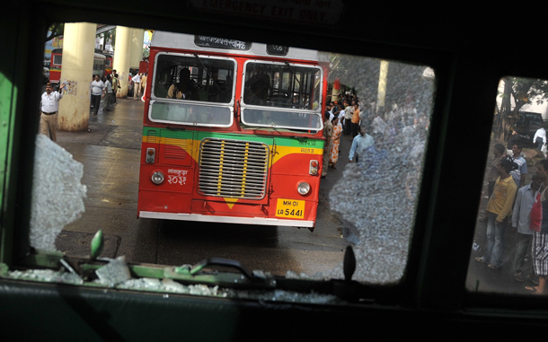 A broken windshield of a bus is seen during a nationwide strike in protest of fuel price hikes in Mumbai. Police came out in force in cities across India for an opposition-led national strike over fuel price rises that disrupted flights and train services, and closed schools and businesses. The strike was called by the main opposition Bharatiya Janata Party (BJP) and leftist parties in a concerted show of strength against the Congress-led government's reform programme. (AFP)