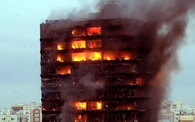 A massive fire raging at the Kuwait Tower building in Butina along Sharjah-Ajman road on Tuesday night. (CHANDRA BALAN)