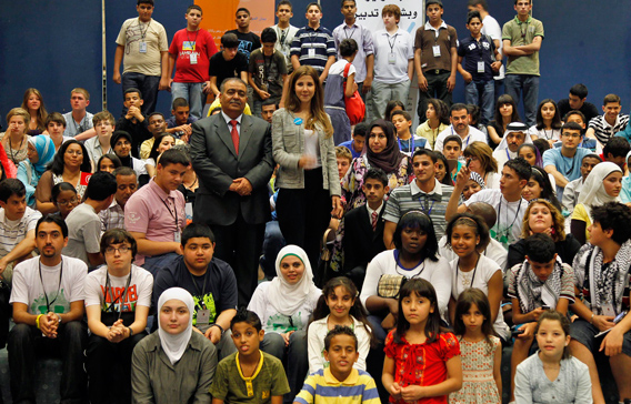 Lebanese singer Nancy Ajram, UNICEF's Regional Goodwill Ambassador for the Middle East and North Africa, and Jordanian actor Musa Hjazeen (L) pose with children after their meeting with participants of the International Arab Children Congress in Amman. Ajram will be the guest of honour at the 30th International Arab Children Congress which opens today. (REUTERS)