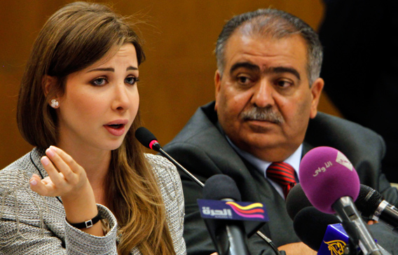 Jordanian actor Musa Hjazeen (R) listens as Lebanese singer Nancy Ajram, UNICEF's Regional Goodwill Ambassador for the Middle East and North Africa, speaks during a meeting with participants of the International Arab Children Congress in Amman. Ajram will be the guest of honour at the 30th International Arab Children Congress which opens today. (REUTERS)