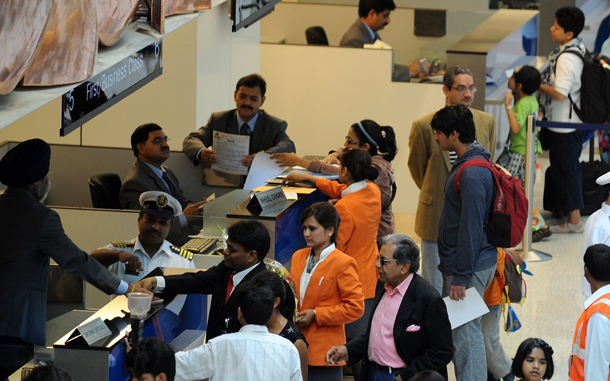 Passengers on an Air India flight from New York pass through immigration counters at terminal T-3 of Indira Gandhi International airport in New Delhi. An Air India plane carrying more than 200 passengers from New York became the first commercial flight to land at New Delhi's new, 2.7-billion-dollar airport terminal. (AFP)