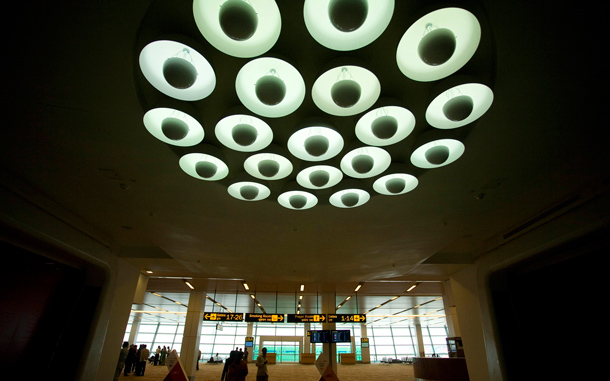 Lights on the ceiling are illuminated at the newly inaugurated Indira Gandhi International Airport Terminal 3 in New Delhi, India. Top government officials unveiled a multibillion dollar, glittering steel and glass new airport terminal in the Indian capital Saturday months ahead of playing hosting to the Commonwealth Games. The ultramodern new terminal was built in just 37 months at a cost of nearly three billion dollars and will be ready for passengers on July 16. (AP)