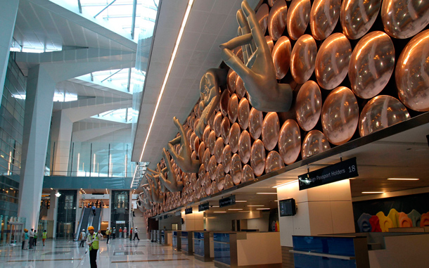 Labourers work inside the newly constructed Terminal 3 at Indira Gandhi International Airport in New Delhi. (REUTERS)