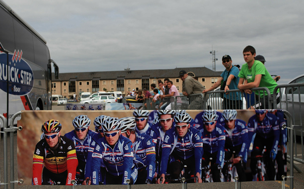 Fans wait for riders to emerge from the Quick Step bus before the start of stage Stage 13 of the Tour de France. The hilly stage from Rodez featured a final climb, the category three 1.9-kilometres Saint-Ferreol. While Luxembourg's Andy Schleck of team Saxo Bank continues to wear the yellow jersey, Astana rider Alexandre Vinokourov won the stage.The iconic bicycle race will include a total of 20 stages and will cover 3,642km before concluding in Paris on July 25. (GETTY IMAGES)