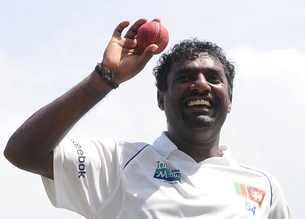 Sri Lankan cricketer Muttiah Muralitharan holds up the cricket ball as he walks back to the pavilion at the end of India's second innings during the fifth and final day of the first cricket Test match between Sri Lanka and India at The Galle International Cricket Stadium in Galle. Retiring world bowling record holder Muttiah Muralitharan of Sri Lanka reached the 800-wicket mark with his last delivery in Test cricket.  The off-spinner, 38, had last man Pragyan Ojha caught at slip by Mahela Jayawardene to terminate India's second innings after lunch on the final day of the first Test at the Galle International Stadium. India, who were made to follow on 244 runs behind, were all out for 338 in their second knock. (AFP)