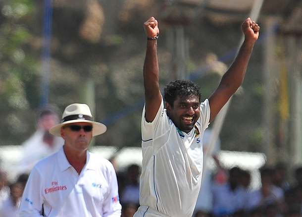 Sri Lankan cricketer Muttiah Muralitharan (R) celebrates claming his 800th Test wicket with the dismissal of Indian cricketer Pragyan Ojha during the fifth and final day of the first cricket Test match between Sri Lanka and India at The Galle International Cricket Stadium in Galle. Hosts Sri Lanka were well-placed to win the first Test against India after spin wizard Muttiah Muralitharan wreaked havoc in his final match. The world's leading wicket-taker grabbed 5-63 in the first innings as India were forced to follow on after being shot out for 276 on the fourth day in reply to Sri Lanka's 520-8 declared. Sling-arm fast bowler Lasith Malinga then claimed three wickets to leave the tourists' second innings tottering at 181-5 at stumps, still 63 runs away from avoiding an innings defeat. (AFP)