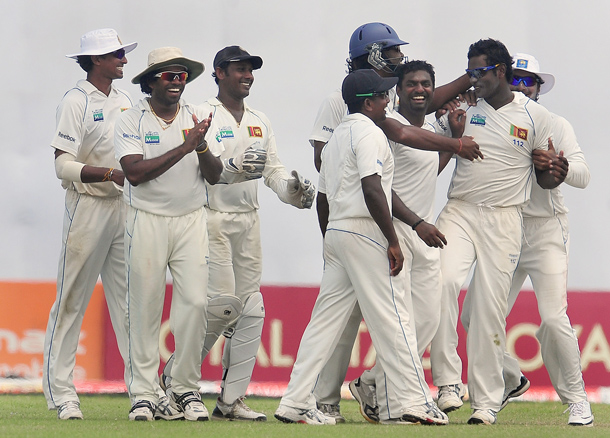 Sri Lankan cricketers celebrate the dismissal of Indian cricketer V VS Laxman during the fifth and final day of the first cricket Test match between Sri Lanka and India at The Galle International Cricket Stadium in Galle. Hosts Sri Lanka were well-placed to win the first Test against India after spin wizard Muttiah Muralitharan wreaked havoc in his final match. The world's leading wicket-taker grabbed 5-63 in the first innings as India were forced to follow on after being shot out for 276 on the fourth day in reply to Sri Lanka's 520-8 declared. Sling-arm fast bowler Lasith Malinga then claimed three wickets to leave the tourists' second innings tottering at 181-5 at stumps, still 63 runs away from avoiding an innings defeat. (AFP)