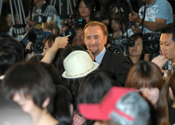 Actor Nicolas Cage signs autographs during the "The Sorcerer's Apprentice" Japan Premiere at Odaiba Cinema Mediage in Tokyo, Japan. The film will open on August 13 in Japan. (GETTY IMAGES)