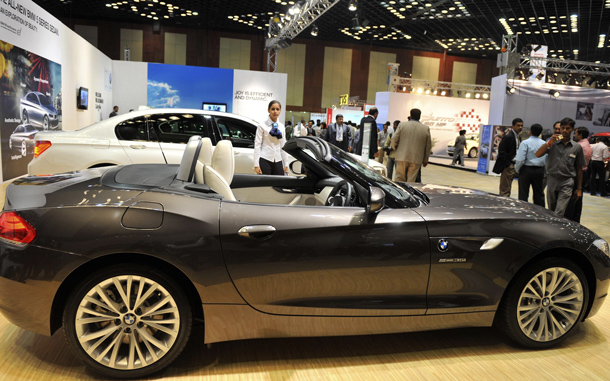 Indian delegates and staff look at BMW Z4s Drive35i on display at The Hyderabad International Auto Show 2010 at The Hyderabad International Convention Centre (HICC) in Hyderabad. The event in the southern Indian city will continue until July 25. (AFP)