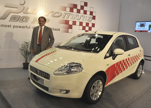 Vice President-Commercial Fiat India Ravi Bhatia poses beside a Fiat Grande Punto 90 HP Multijet on display at The Hyderabad International Auto Show 2010 at The Hyderabad International Convention Centre (HICC) in Hyderabad. The Multijet will cost approximately Indian Rupees 693000 (USD 14,700). (AFP)