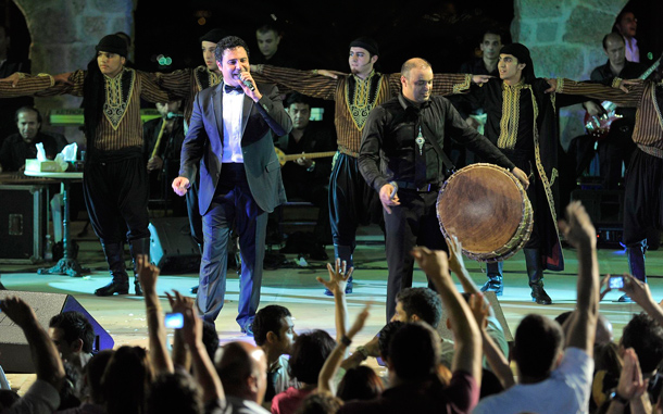 Lebanese singer Assi El-Hellani (L), performs on the main stage at the Zouk Mikael International Festival, in Zouk Mikael, north of Beirut, Lebanon. The annual Festival runs from 09 July to 28 July 2010. (EPA)