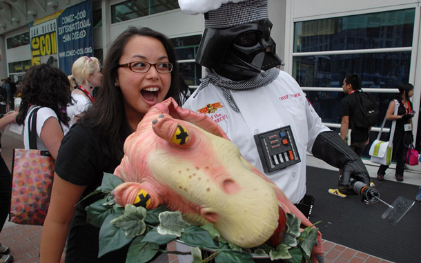 Vaness Baumann, 25, gets her photograph taken with Michael Olsen (R) dressed as the Star Wars character Darth Vader, whom he has changed to “Chef Vader” at the comic book convention Comic Con. (AFP)