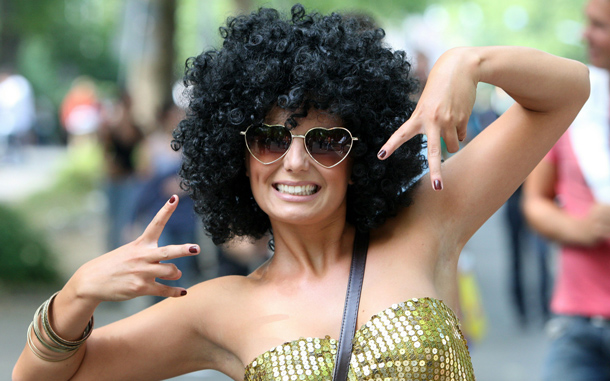 A woman attends the Love Parade festival in Duisburg, Germany. At least 18 people were crushed to death and dozens injured in a stampede at Germany's famous Love Parade festival. Thousands of other revelers kept partying at the event unaware of the deadly stampede that started when police tried to block thousands more people from entering the already-jammed parade grounds. (GETTY IMAGES)