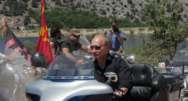 Russia's Prime Minister Vladimir Putin rides a Harley Davidson Lehman Trike as he visits Russian and Ukrainian motorbikers at their camp near Sevastopol in Ukraine's Crimea. (AFP)