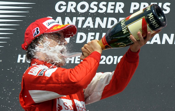 Ferrari's Spanish driver Fernando Alonso celebrates on the podium of the Hockenheimring circuit on July 25 in Hockenheim, after the Formula One German Grand Prix. AFP