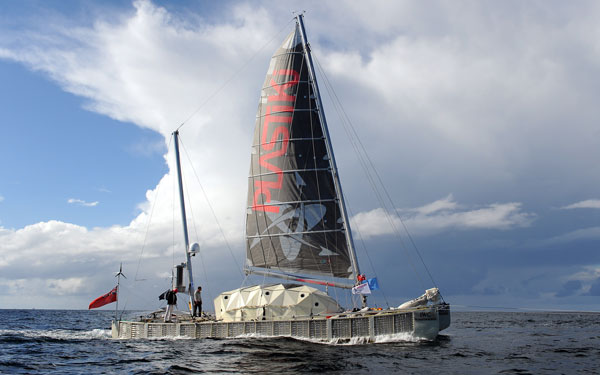 The 'Plastiki', a boat made from 12,500 plastic bottles, completes her 8,000-nautical mile trans-Pacific voyage from San Francisco as she approaches Sydney Harbour. (AFP)