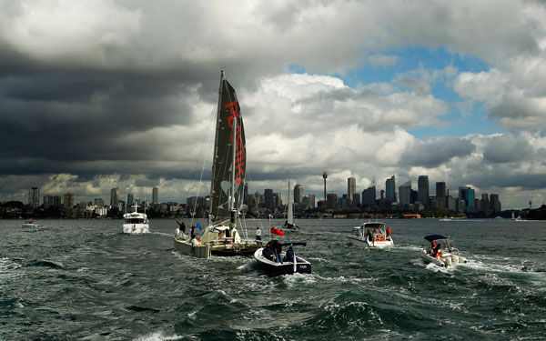 The 'Plastiki', a boat made from 12,500 plastic bottles, completes her 8,000-nautical mile trans-Pacific voyage from San Francisco as she approaches Sydney Harbour. (AFP)