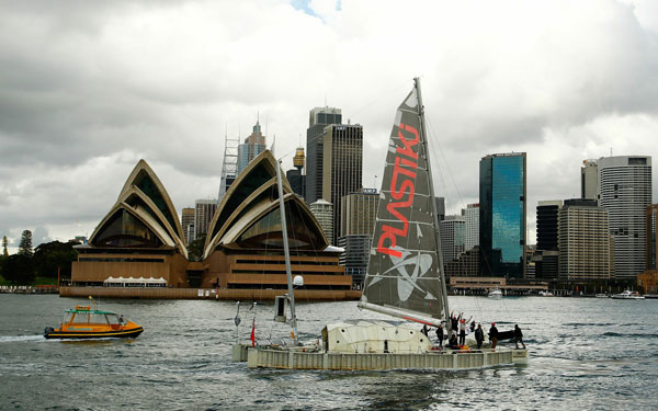 British adventurer and environmentalist David de Rothschild sails as the "Plastiki" arrives at Sydney Harbour, completing the 12,860 kilometre journey from San Francisco to raise environmental awareness in Sydney, Australia. (GETTY IMAGES)