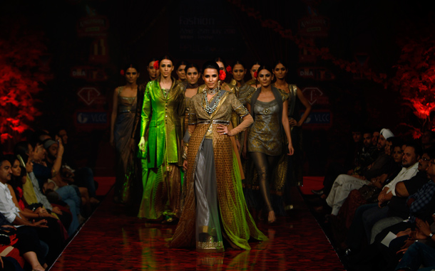 Bollywood actress Neha Dhupia, centre, and models present creations by J J Valaya at Bangalore Fashion Week in India. Dhupia is currently working on two films. (AP)