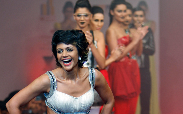 Models applaud as Bollywood actress Mandira Bedi, foreground, presents a creation by designer Swapnil Shinde at the Bangalore Fashion Week in Bangalore, India. (AP)