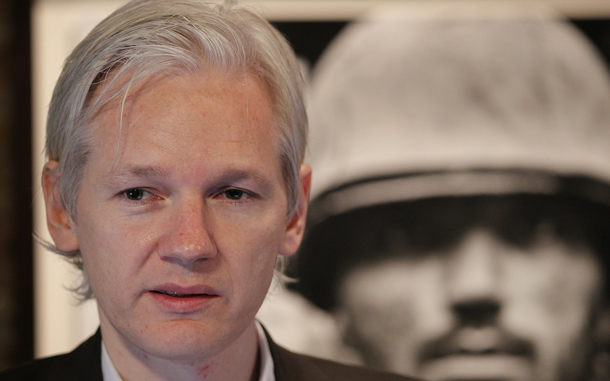 Julian Assange of the WikiLeaks website speaks to reporters in front of a Don McCullin Vietnam war photograph at The Front Line Club in London, England. The WikiLeaks website has published 90,000 secret US Military records. The Guardian and The New York Times newspapers and the German Magazine Der Spiegel have also published details today.  (GETTY IMAGES)