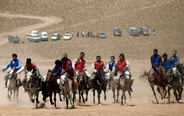 Afghan horsemen compete for the goat carcass during a game of buzkashi in Afghanistan. (GETTY IMAGES)