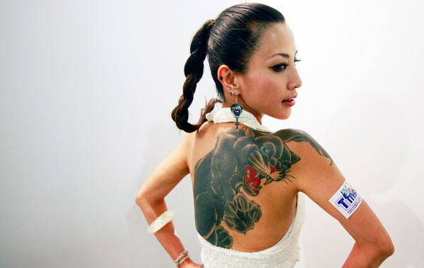 A model displays her back at the 2010 Taiwan International Tattoo Convention in Taipei. (REUTERS)