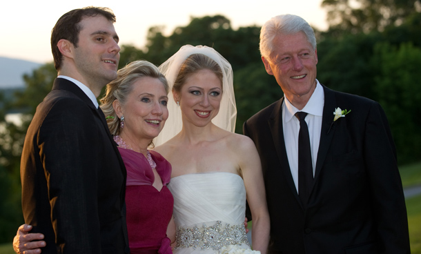 Former US president Bill Clinton (R) and wife US Secretary of State Hillary Clinton (2nd-L) are pictured with Chelsea Clinton (2nd-R) during her marriage ceremony with Marc Mezvinsky (L) in Rhinebeck, New York.  (AFP)