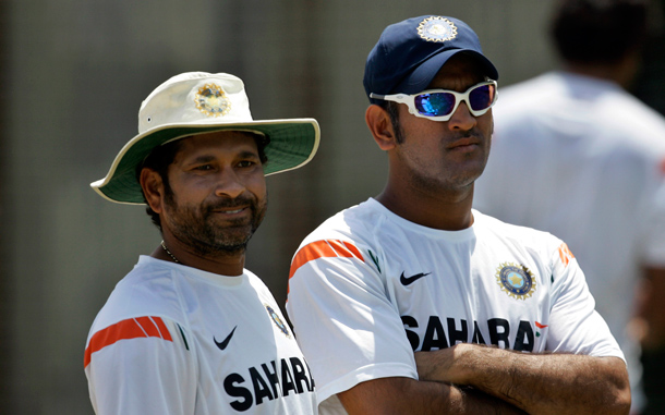 India's cricket captain Mahendra Singh Dhoni, right, and batsman Sachin Tendulkar look on during a practice session in Colombo, Sri Lanka. (AP)