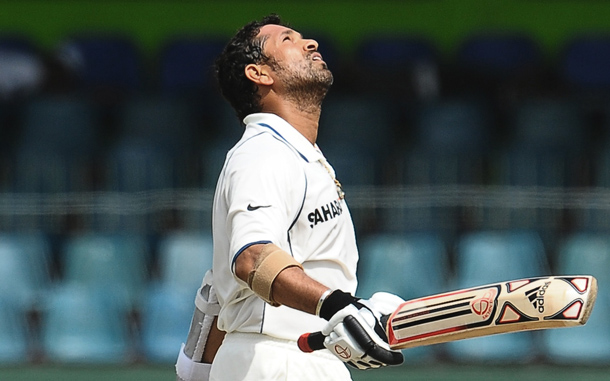 Indian cricketer Sachin Tendulkar reacts upon completing a double century (200 runs) during the fourth day of the second Test match between Sri Lanka and India at The Sinhalese Sports Club Ground in Colombo. Sri Lankan cricketers Muttiah Muralitharan and Lasith Malinga claimed 15 of the 20 Indian wickets in the first Test in Galle last week, which Sri Lanka won by 10 wickets to take a 1-0 lead in the three-match series. (AFP)