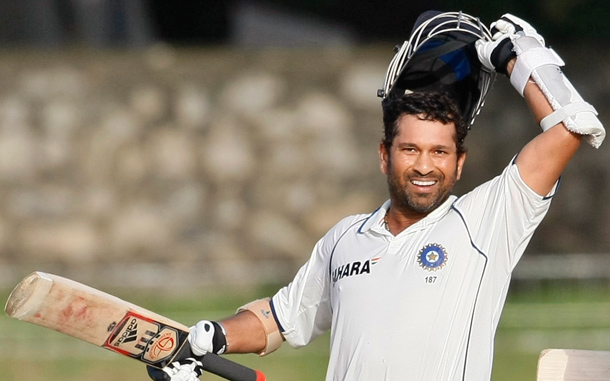 Indian cricketer Sachin Tendulkar celebrates after scoring a century during the third day of the second test cricket match between India and Sri Lanka in Colombo, Sri Lanka. Prolific batsman Tendulkar has scored his 48th test century and shared an unbroken 141-run partnership for the fifth wicket with debutant Suresh Raina to lead India's fightback in the second cricket test against Sri Lanka. (AP)