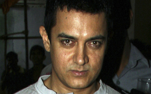 Indian Bollywood producer and actor Aamir Khan arrives for a promotional event for the Hindi film “Peepli Live” film in Mumbai. (AFP)