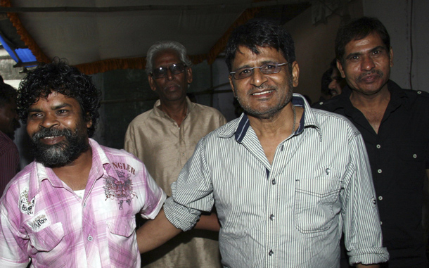 Indian Bollywood actors Omkar Das (L) and Raghubir Yadav arrives for a promotional event for the Hindi film “Peepli Live” film in Mumbai. (AFP)