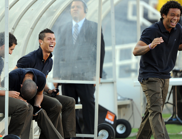 Real Madrid striker Christiano Ronaldo of Portugal jokes with his teammates Pepe of Portugal (L) and Marcelo of Brazil (R) before the friendly game Los Angeles Galaxy vs Real Madrid in Pasadena, California. (AFP)