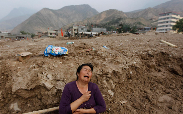 A woman mourns her missing relatives in the mudslide-hit Zhouqu County of Gannan Tibetan Autonomous Prefecture,northwest China's Gansu province. The death toll rose to 337 with more than 1,000 people still missing after floods and landslides engulfed villages in north-western China. Soldiers and volunteers searched debris for survivors in Zhouqu county, Gansu province, two days after floods carried mud and rubble down a mountain into the Bailong valley. Officials confirmed 337 death and listed 1,148 people as missing. (EPA)