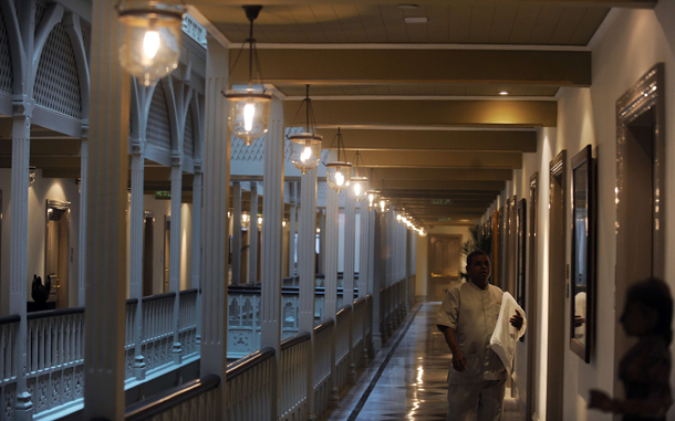 Hotel staff walk through the newly-restored heritage wing of Mumbai's landmark Taj Mahal Palace and Tower hotel is seen before its reopening on August 15.  (AFP)