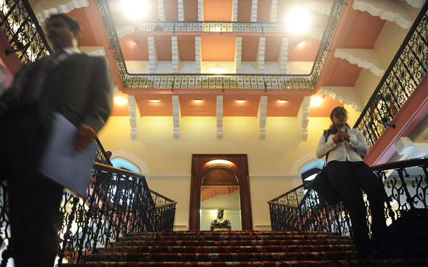 Visitors walk through the newly-restored heritage wing of Mumbai's landmark Taj Mahal Palace and Tower hotel is seen before its reopening on August 15. (AFP)