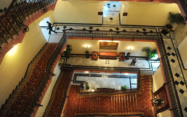 Hotel staff walk through the newly-restored heritage wing of Mumbai's landmark Taj Mahal Palace and Tower hotel is seen before its reopening. Restoration work on the 105-year old section of the luxury hotel has taken 18 months after it was badly-damaged by fire, shooting and explosions when four heavily-armed Islamist gunmen stormed the building on November 26, 2008. (AFP)