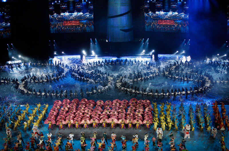 Performers form the Olympic rings during the opening ceremony which marks the start of the inaugural Youth Olympic Games. (AP)