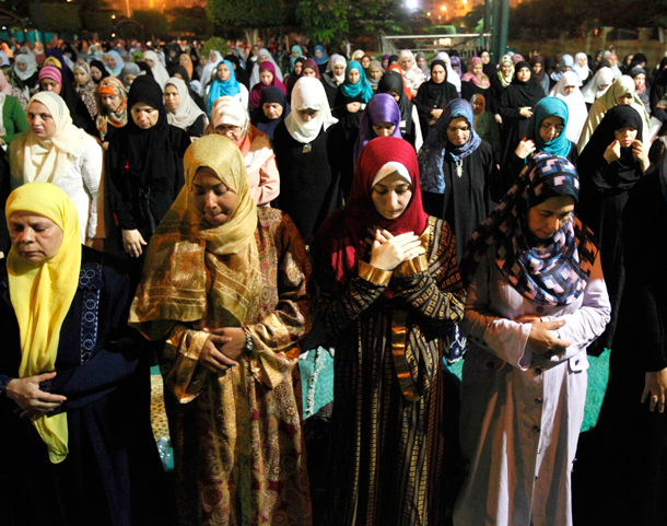 Muslim women attend a mass prayer session "Tarawih" during the holy fasting month of Ramadan at a mosque in Cairo. Muslims around the world abstain from eating, drinking and conducting sexual relations from sunrise to sunset during Ramadan, the holiest month in the Islamic calendar. (REUTERS)